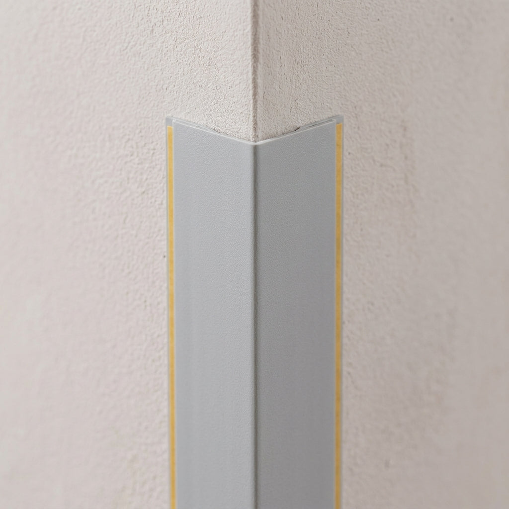 Self-adhesive PVC corner angle trim – close-up of a grey trim on a corner