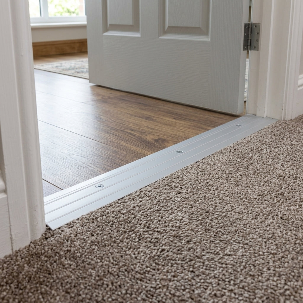 Anodised aluminium door threshold strip, 37 mm x 1000 mm – silver strip fitted between a wooden floor and carpet