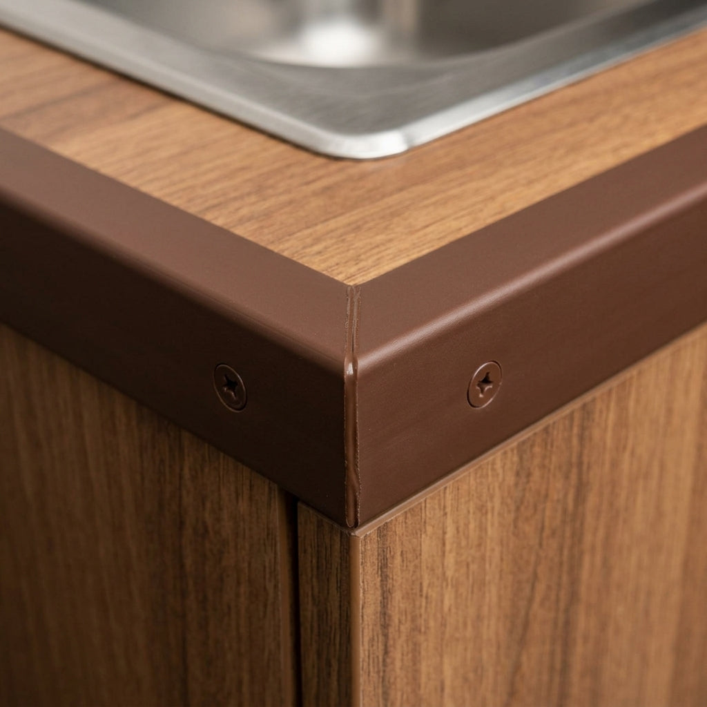 Brown PVC corner angle trim – fitted on the corner of a worktop
