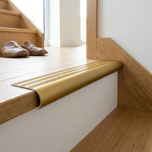 Aluminium bullnose stair nosing, 62 x 38 mm – gold bullnose fitted on a step