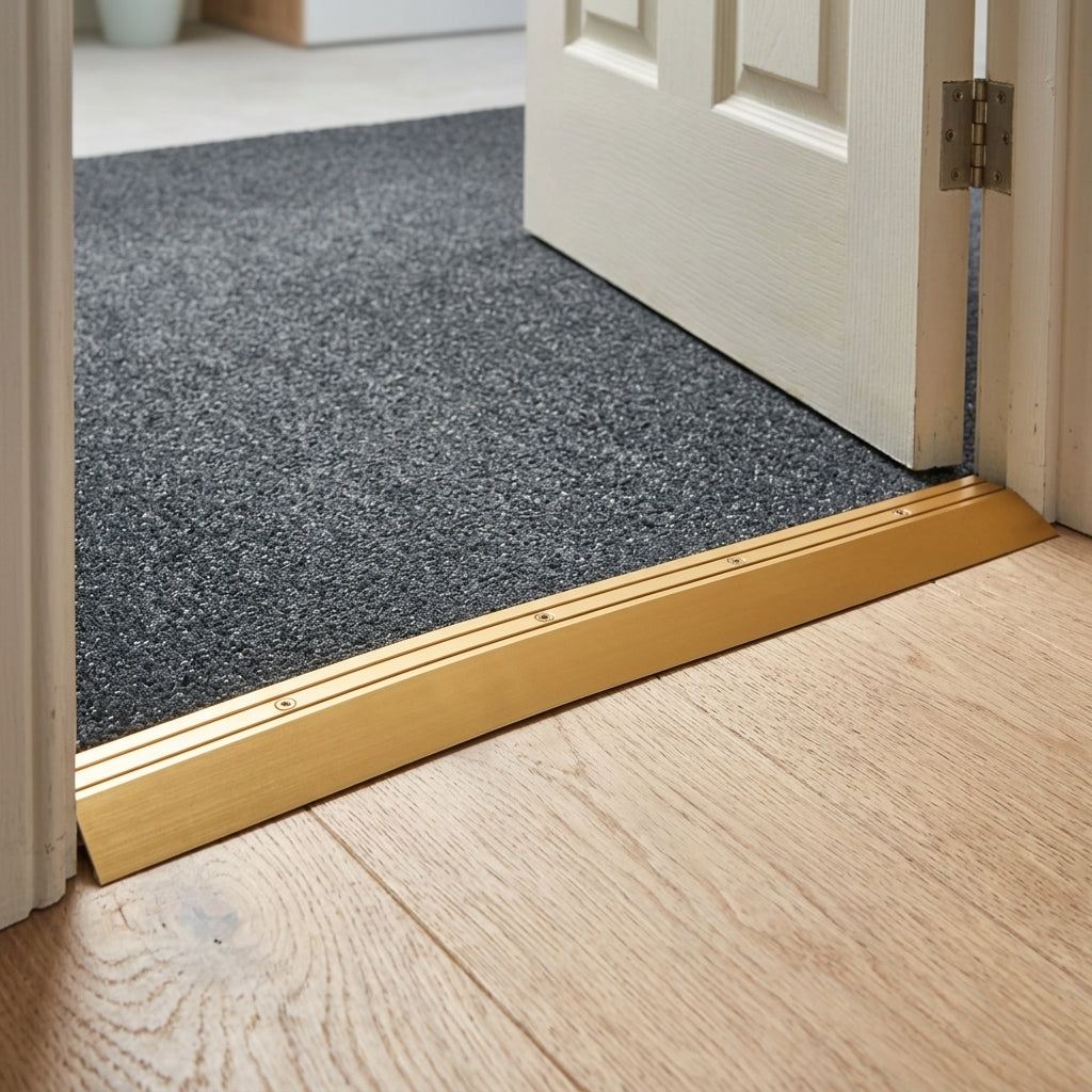 Aluminium floor ramp threshold strip, 45 x 16 mm – gold ramp strip fitted in a doorway next to carpet