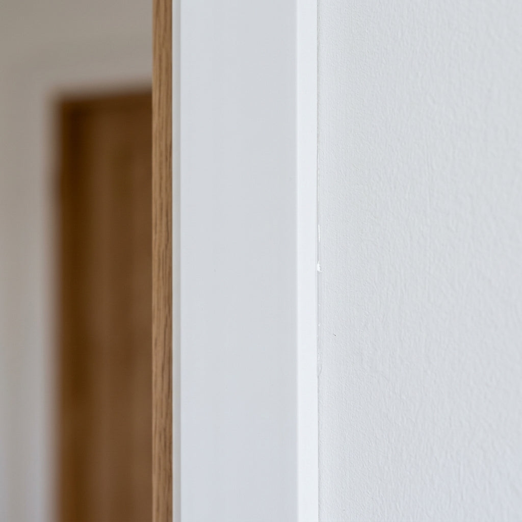 White PVC flat architrave trim – close-up of the white architrave