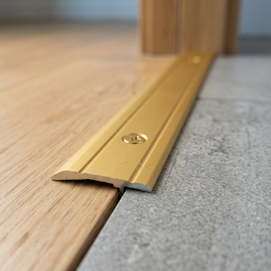 Flat aluminium door threshold strip, 30 x 4 mm – close-up showing the screw fixing