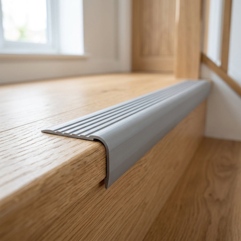 Self-adhesive non-slip PVC stair nosing, 40 x 25 mm – grey nosing fitted on an oak step